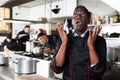 Dissatisfied african american male chef in kitchen of restaurant Royalty Free Stock Photo