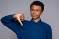 Dissatisfied African American teen shows gesture
