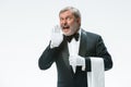 Senior waiter holding white towel