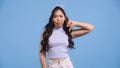 dissatisfied asian woman in crop top