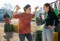 Dissatisfied Asian woman farmer reprimanding young female worker Royalty Free Stock Photo