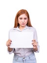 Dissatisfied Asian woman holding blank white paper banner for protested with frown face. studio portrait shot isolated on white Royalty Free Stock Photo