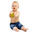 Dissatisfied boy disclaims pears on a white background