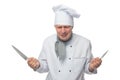 Dissatisfied cook, holds 2 knives in his hands