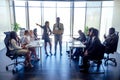 Dissatisfied senior korean boss scolding employees for bad work at diverse group meeting, result at office briefing