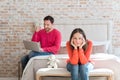 Dissatisfied unhappy woman sitting in the bedroom