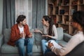 Dissatisfied unhappy young european guy and lady quarrel in clinic interior