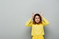 dissatisfied woman with hands near head