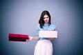 Dissatisfied woman opening gift Royalty Free Stock Photo