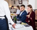 Dissatisfied young couple expressing dissatisfaction with food