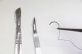 Dissection Kit - Absorbable suture, polyglycolic acid. Surgery operation equipment, knife, needle and suture Royalty Free Stock Photo