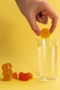 Dissolvable drinks dissolving cubes to add superfoods. On a yellow background. Vertical photo