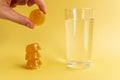 Dissolvable drinks dissolving cubes to add superfoods. On a yellowbackground