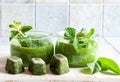 Dissolvable green smoothie Drink made from frozen compressed fruit cubes. Close up, selective focus