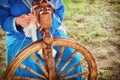 Distaff creates a thread from a spindle. Hand spinning wheel in nature, close-up