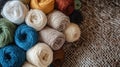 Distaff Day Colorful yarn balls on burlap fabric background for craft and textile projects Royalty Free Stock Photo
