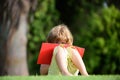 Distance children education. Cute pupil writing at notebook at the elementary school. Little student boy in primary Royalty Free Stock Photo