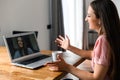 A young woman using laptop for video call, zoom