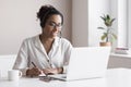 Distance education, e-learning concept. Woman using laptop computer at home, studying online. Student girl working in her room. Wo Royalty Free Stock Photo