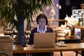 Distance job. Concentrated african american woman freelancer using laptop working remotely in cafe Royalty Free Stock Photo