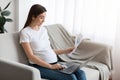 Distance Job Opportunities. Pregnant Woman Working With Documents And Laptop At Home Royalty Free Stock Photo