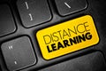 Distance learning - education of students who may not always be physically present at a school, text button on keyboard Royalty Free Stock Photo