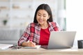 Distance Learning. Happy Asian Woman Study At Home With Laptop