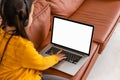 Distance Learning. Mockup Image Of Little Girl Using Laptop With Blank Screen At Home, Studying Online With Computer