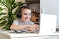 Distance learning online education. A schoolboy is studying at a computer at home and doing school homework. quarantine Royalty Free Stock Photo