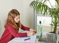Distance Learning Online Education. Schoolgirl Studying At Home With A Laptop And Doing School Homework. Training Books