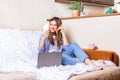 Distance learning online education and work. Business woman having a facetime video call. Happy and smiling girl working from home Royalty Free Stock Photo