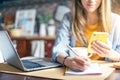 Distance learning online education and work. Business woman writes in notebook on desk. Happy and smiling girl working from home Royalty Free Stock Photo