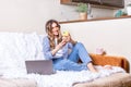 Distance learning online education and work. Woman in headphones having a video call. Happy and smiling girl working Royalty Free Stock Photo