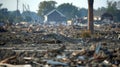 In the distance a lone chimney stands tall a a sea of fallen homes a grim reminder of the devastation caused by