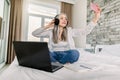 Distance work, online searching and communication. Elderly happy smiling woman in headphones having a video call, while Royalty Free Stock Photo