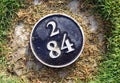 Distance yardage marker on golf course Royalty Free Stock Photo