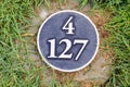 Distance yardage marker on golf course Royalty Free Stock Photo