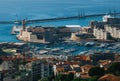 Distant aerial overview of Saint Jean castle and Vieux port harbor entrance from Notre Dame de la Garde hill. Scenic travel Royalty Free Stock Photo