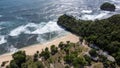 The distant aerial view of Boat Hill is taken from Goa Cina Beach in Indonesia