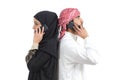 Distant arab couple calling on the phone