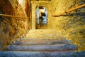 Distant blurred image of person near top of old stone stairway i