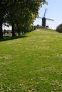 Distant Bruge Windmill with path Royalty Free Stock Photo