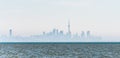 Foggy city skyline of Toronto on Lake Ontario.