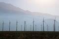 Desert mountain row wind farm silhouette sunset Royalty Free Stock Photo