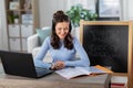 teacher with laptop having online class at home Royalty Free Stock Photo