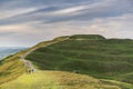 Distant hill walkers enjoying the Malvern Hills, on a summer morning