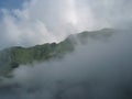 Distant hills and mountains above a sea of fog and mist, the mist in winter Landscape Royalty Free Stock Photo