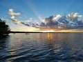 Distant kayakers on Coot Bay in Everglades National Park at sunset. Royalty Free Stock Photo