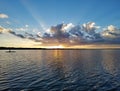 Distant kayakers on Coot Bay in Everglades National Park at sunset. Royalty Free Stock Photo