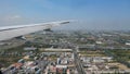 Distant landscape against blue sky under airplane wing Royalty Free Stock Photo